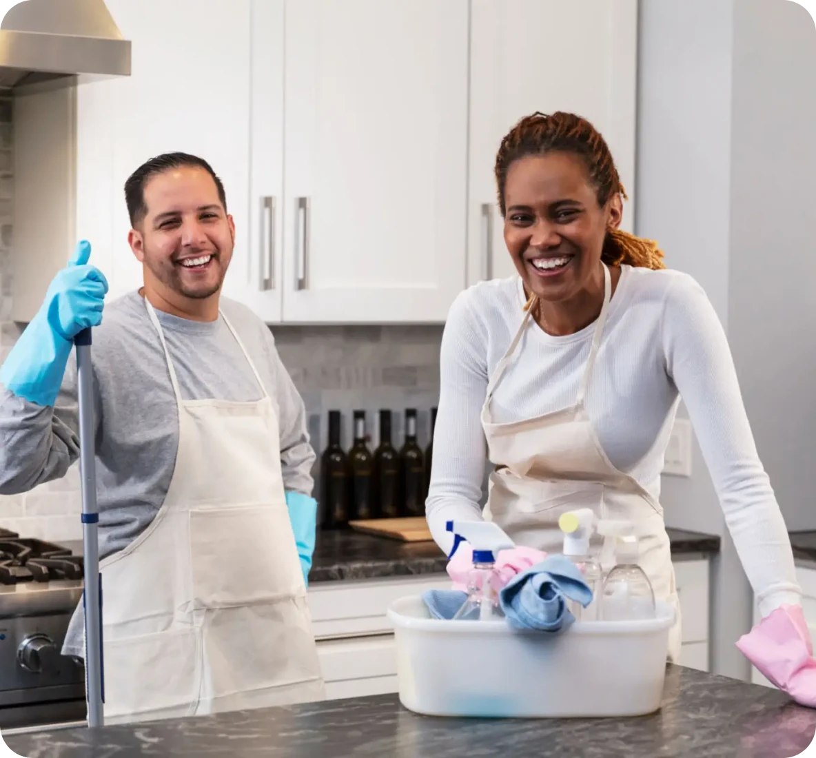 Happy cleaners with cleaning supplies